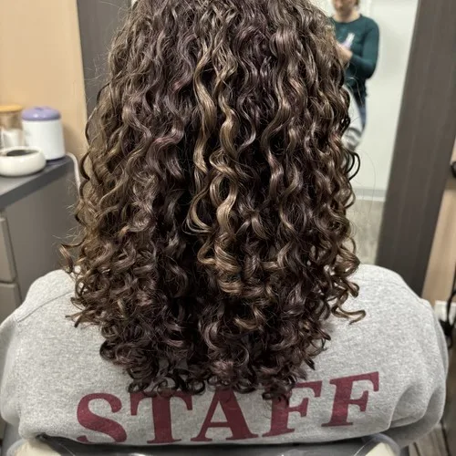 Client with defined brunette ringlets after a curly cut at Curls Done Wright